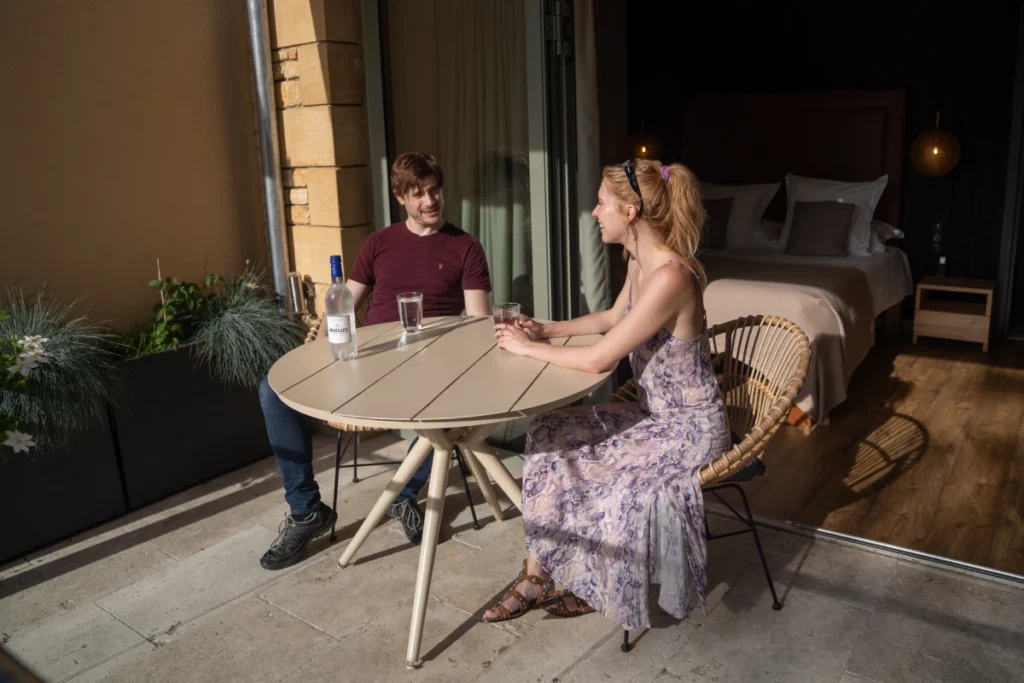 A couple enjoying a Late check out when booking Autum Offer in Dordogne at La Perle de Domme